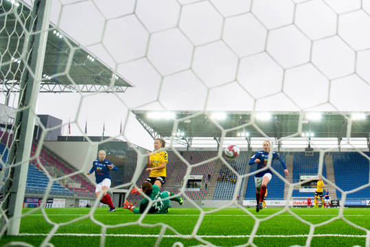 Synne Hansen of LSK Kvinner scores 0-1 behind goalkeeper