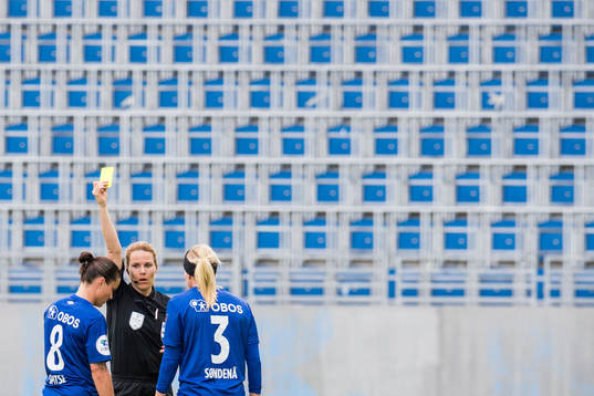 Sherida Spitse of Vålerenga is shown a yellow card by