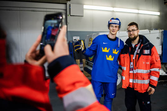 Elias Pettersson of Sweden takes selfies with supporters