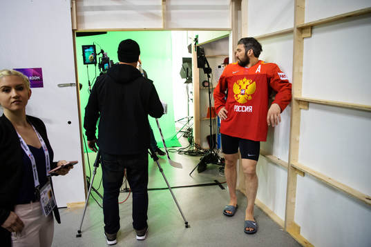 Alexander Ovechkin of Russia watches goaltender Jhonas