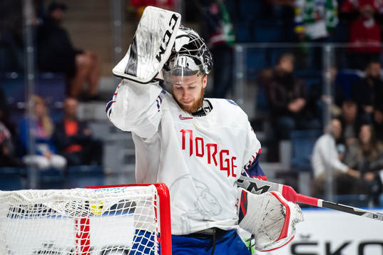Goaltender Henrik Haukeland of Norway looks dejected