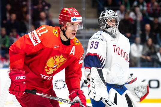 Evgeni Malkin of Russia and goaltender Henrik Haukeland of