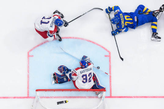 Dennis Rasmussen of Sweden against Michal Moravcik and
