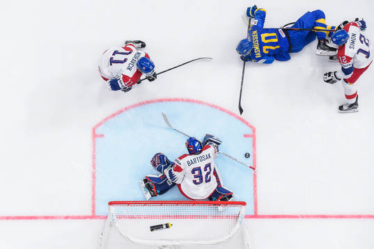 Dennis Rasmussen of Sweden against Michal Moravcik, Dominik