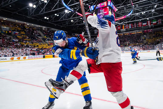 Adam Larsson of Sweden against Dmitrij Jaskin of Czech