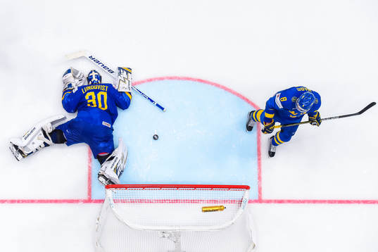 Goaltender Henrik Lundqvist and Robert Hägg of Sweden look