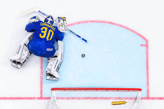 Goaltender Henrik Lundqvist of Sweden looks dejected