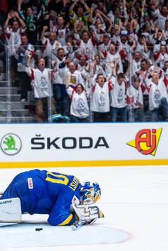 Goaltender Henrik Lundqvist of Sweden looks dejected