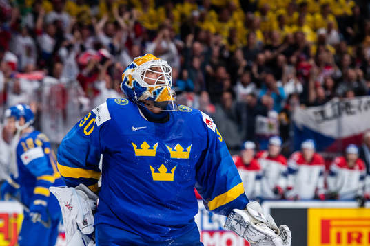 Goaltender Henrik Lundqvist of Sweden looks dejected