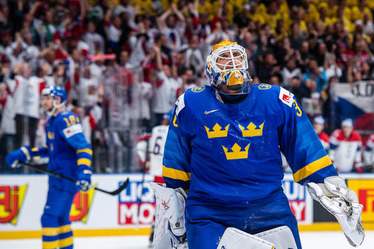 Goaltender Henrik Lundqvist of Sweden looks dejected