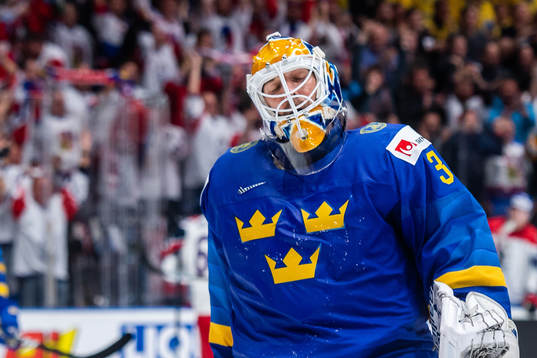 Goaltender Henrik Lundqvist of Sweden looks dejected