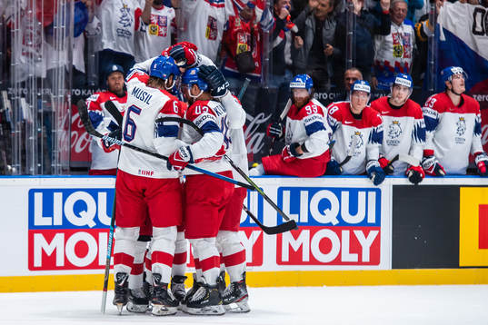 David Musil and Jan Kovar celebrate with Dominik Kubalik of