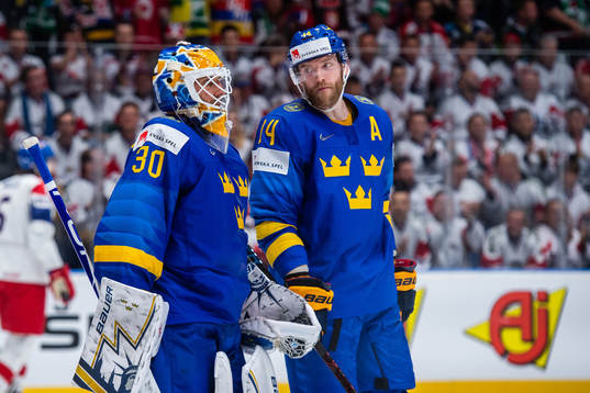 Goaltender Henrik Lundqvist and Mattias Ekholm of Sweden