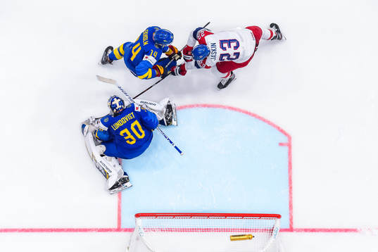 Goaltender Henrik Lundqvist and Mattias Ekholm of Sweden