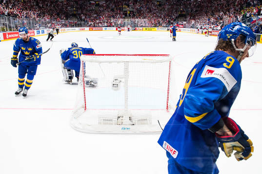 Erik Gustafsson, goaltender Henrik Lundqvist and Adrian