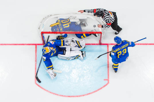Elias Pettersson , Oliver Ekman Larsson and goaltender