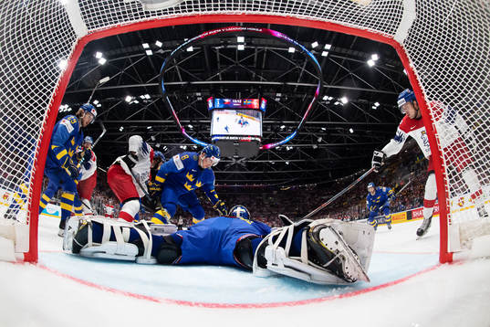 Dominik Simon of Czech Republic (R) in front of goaltender
