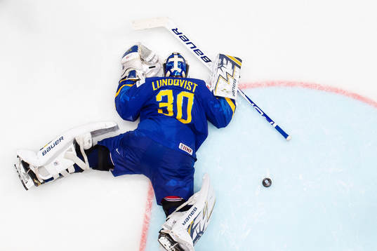 Goaltender Henrik Lundqvist of Sweden looks dejected