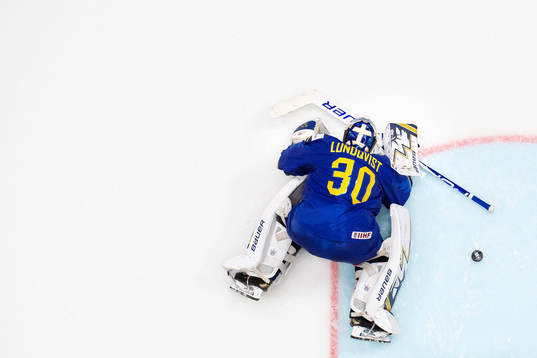 Goaltender Henrik Lundqvist of Sweden looks dejected