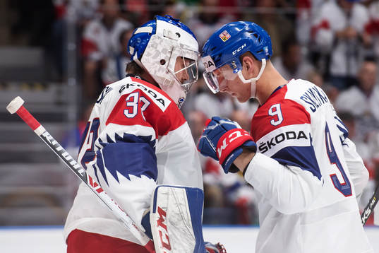 Goaltender Patrik Bartosak and David Sklenicka of Czech