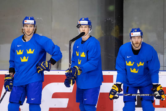 Adrian Kempe, Elias Pettersson and Mattias Ekholm of Sweden