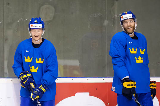 Elias Pettersson and Mattias Ekholm of Sweden at a practice