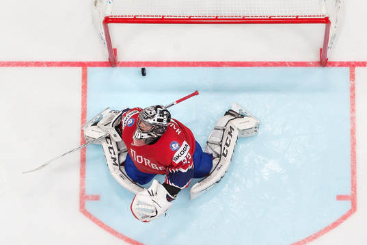 Goaltender Henrik Haukeland of Norway looks dejected