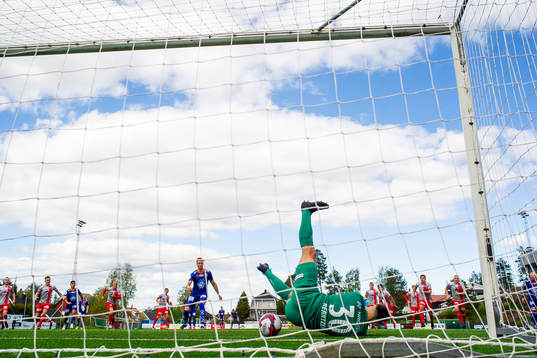 Goalkeeper Marius Berntzen of Strømmen saves a penalty