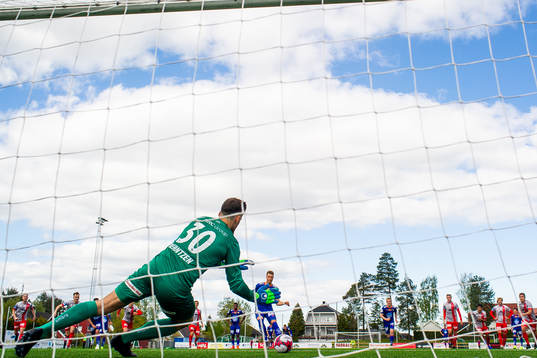 Goalkeeper Marius Berntzen of Strømmen saves a penalty
