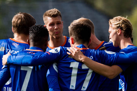 Hólmbert Fridjónsson of Aalesund celebrates with teammates