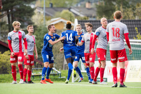 Pape Habib Gueye of Aalesund celebrates with teammates