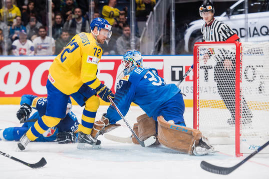 Patric Hörnqvist of Sweden scores 0-2 behind goaltender