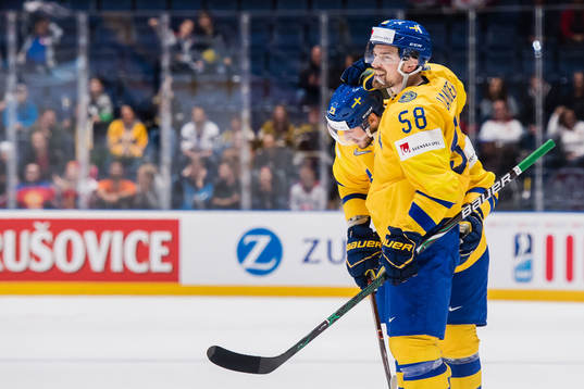 Oliver Ekman Larsson and Anton Lander of Sweden celebrates