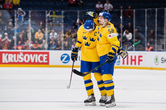 Oliver Ekman Larsson and Anton Lander of Sweden celebrates