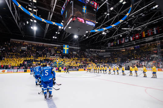 Players of Italy and of Sweden sees the Swedish flag being
