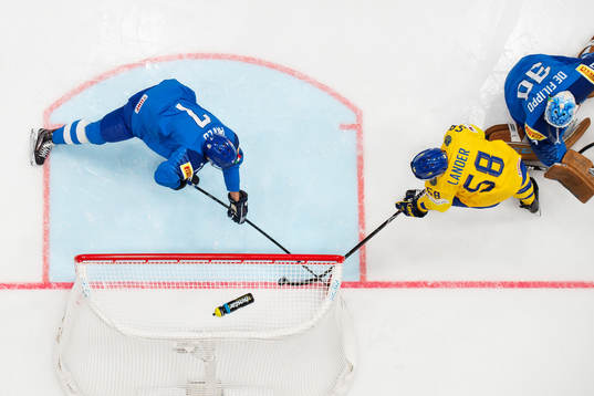 Jan Pavlu and goaltender Marco de Filippo Roia of Italy