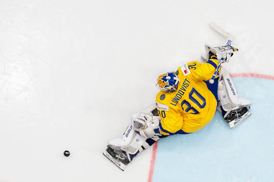 Goaltender Henrik Lundqvist of Sweden makes a save