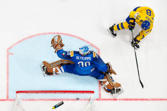 Anton Lander of Sweden scores 0-5 behind goaltender Marco