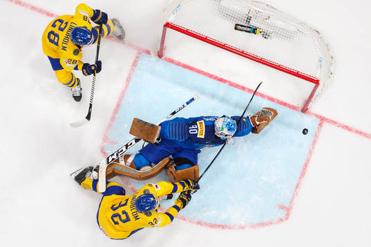 Elias Lindholm and Oskar Lindblom of Sweden in action