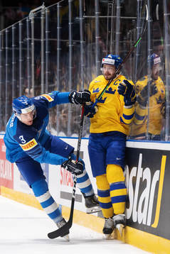 Markus Gander of Italy tackles Oliver Ekman Larsson of