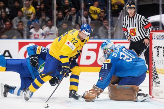 Patric Hörnqvist of Sweden scores 0-3 behind goaltender