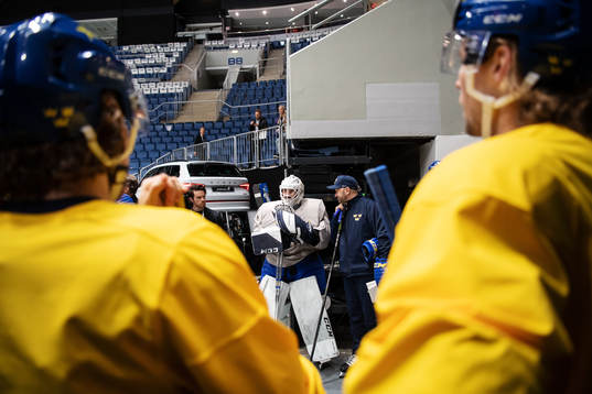 Goaltender Jhonas Enroth and goalie coach Stefan Ladhe of