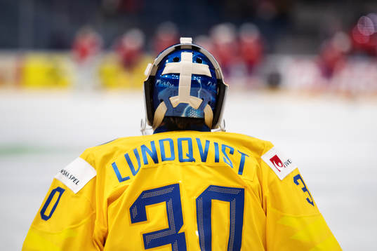 Goaltender Henrik Lundqvist of Sweden has his daughters