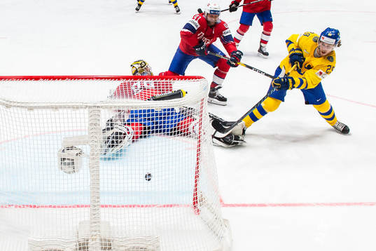 Mario Kempe of Sweden scores the 0-6 goal behind goaltender