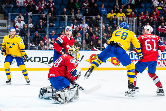 Anton Lander of Sweden against goaltender Henrik Holm of