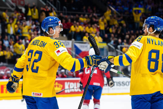 Oskar Lindblom and William Nylander of Sweden celebrate the