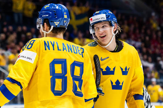 Oskar Lindblom and William Nylander of Sweden celebrate the