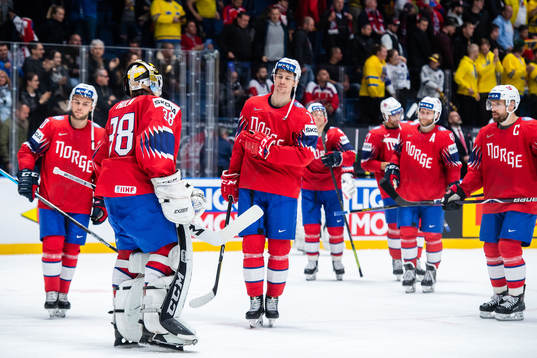 Goaltender Henrik Holm and Sondre Olden of Norway look