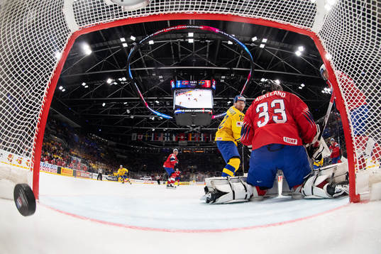 Patric Hörnqvist of Sweden scores 0-2 behind goaltender