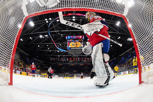 Goaltender Henrik Holm of Norway looks dejected